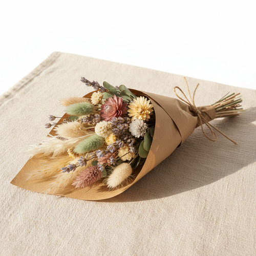 Dried flower mini bouquet in pastel tones wrapped in kraft paper